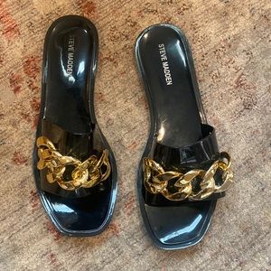 Black Steve Madden sandal with gold chain detail